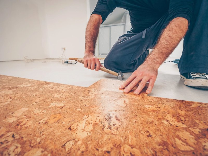 person installing cork flooring from Life Style Floors in Chagrin Falls