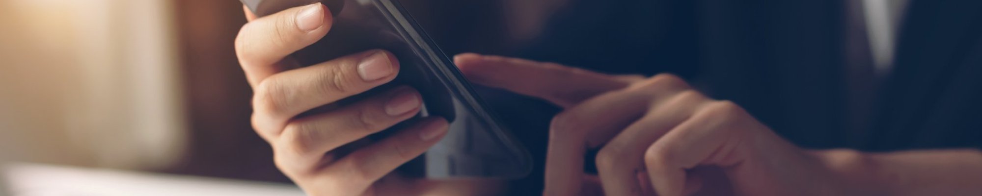 person using smartphone from Life Style Floors in Chagrin Falls, OH