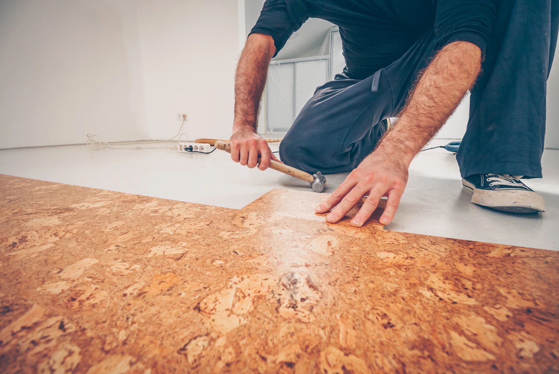 person installing cork flooring from Life Style Floors in Chagrin Falls